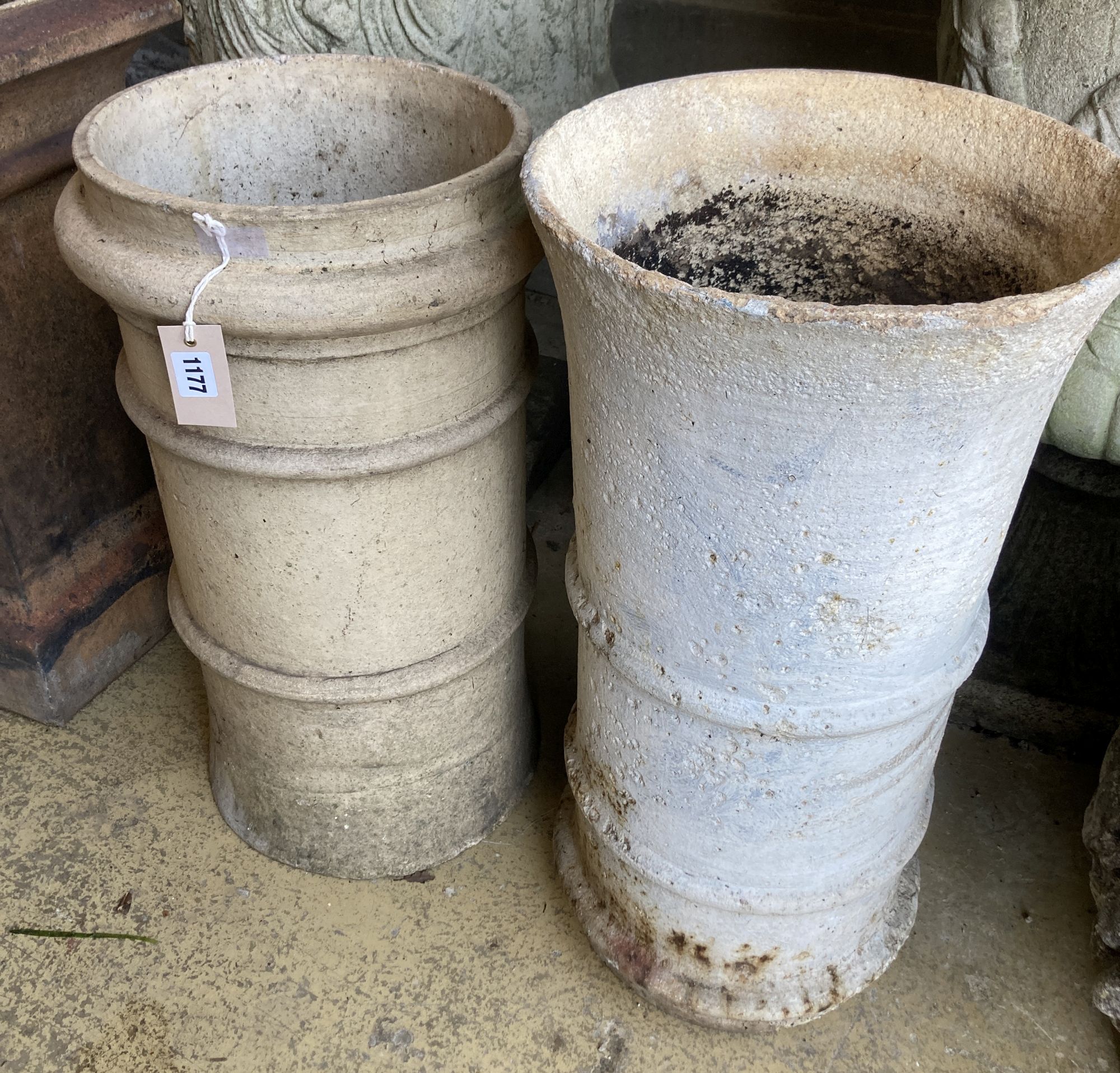 Two glazed earthenware chimney pots, larger 62cm high